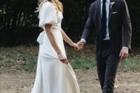 a refined modern plain A-line wedding dress with a square neckline, puff sleeves and a train is a lovely idea
