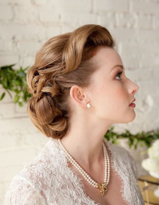 a retro wedding updo with fixed waves and curls on long hair is a very cool idea for a 1940s or 1950s wedding