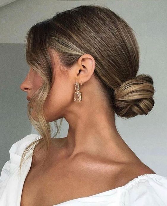 a sleek twisted low bun and some locks framing the face will give you a chic and stylish look instantly