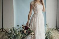 a textural A-line lace wedding dress with short sleeves and a scoop neckline is a chic feminine idea for a church wedding