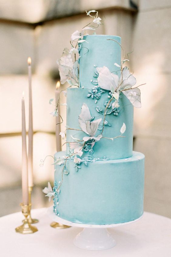 a tiffany blue wedding cake with matching sugar blooms, dried blooms and twigs is a very chic and beautiful spring or summer wedding idea
