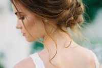 a very chic wavy low updo with a volume on top and some locks down is a great option for many bridal looks