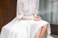 a vintage wedding dress inspired by Victorian style, with a high neckline and buttons, puff sleeves and peep toe shoes