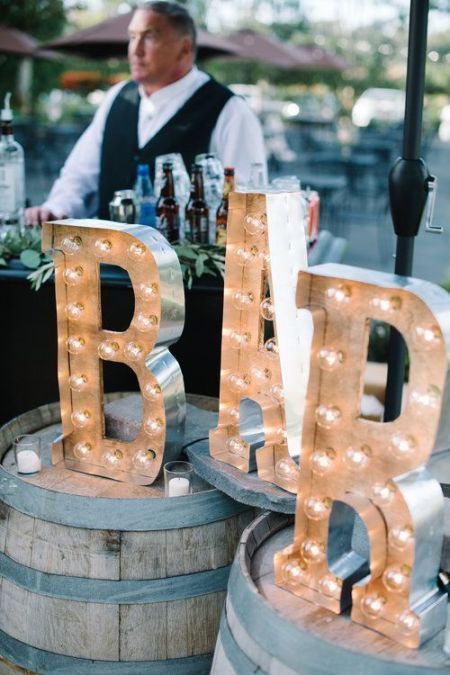 accent your wedding bar with large marquee letters - they are a nice wedding decor idea and you can DIY them