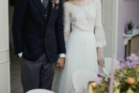 an exquisite wedding dress with a lace bodice with a bateau neckline, flare sleeves and a layered plain skirt