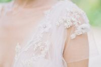 delicate floral appliques with beading and embroidery will make your wedding dress more eye-catchy