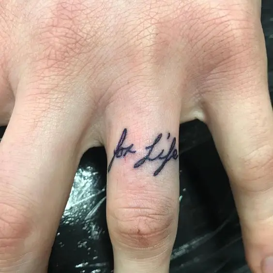 'for life' wedding tattoo placed on the ring finger is a great idea to celebrate your relationship
