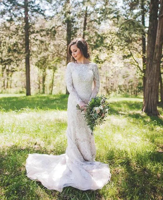high neckline long sleeve wedding dress with a train and lace appliques is a chic and timeless idea