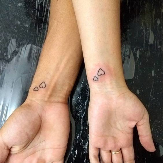 little double heart tattoos on the wrists are amazing for a modern couple, you can make them anywhere