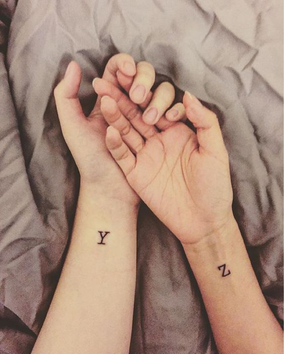monogram tattoos on the wrists are very cool and modern, mark each other's names