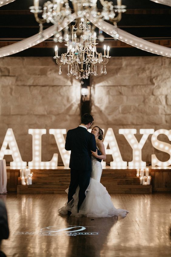 oversized ALWAYS marquee letters can style a dance floor or a ceremony space, add more lights and candles