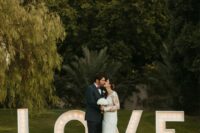 oversized LOVE marquee letters are amazing to take wedding portraits or just to decorate parts of your venue