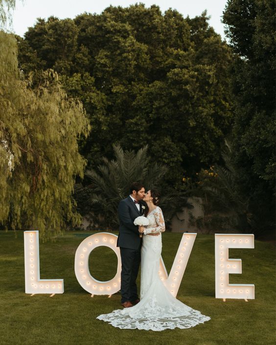 oversized LOVE marquee letters are amazing to take wedding portraits or just to decorate parts of your venue