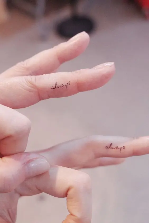 small and delicate 'always' tattoos placed on the fingers are a great idea for any wedding, they are subtle and minimalist