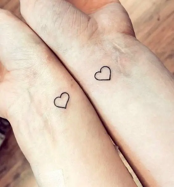 small heart-shaped wrist tattoos are always a great idea to rock at your wedding or any other day