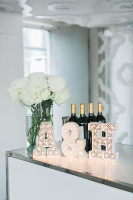 small white marquee monograms and an ampersand are amazing to style any part of your wedding venue
