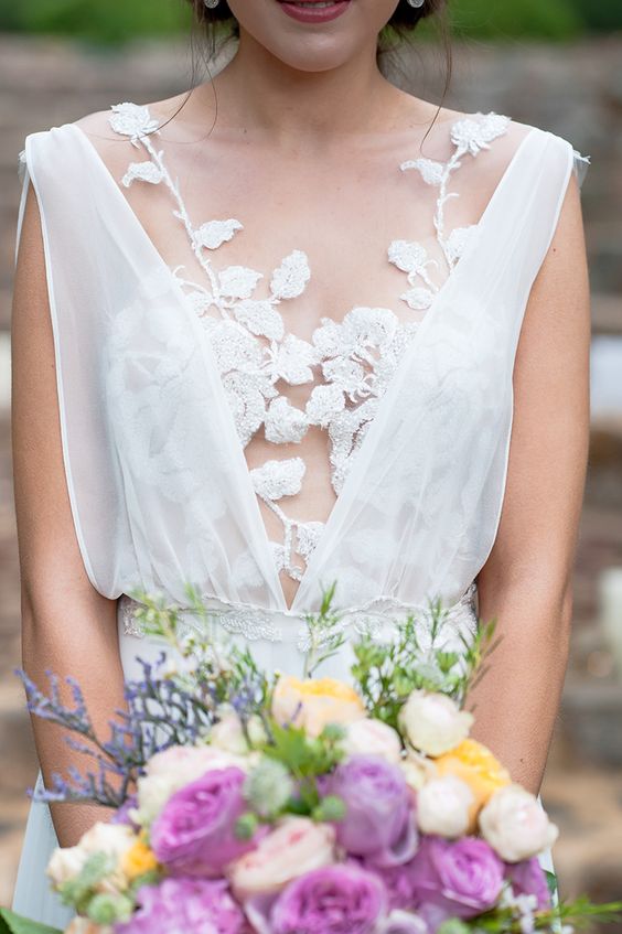 strategically placed floral lace appliques create a unique and very delicate bodice for a wedding dress