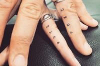 stylish wedding date tattoos made with usual numbers and placed on the sides of the fingers