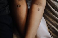 the sun and the moon matching tatotos on the forearms look nice and chic and are stylish
