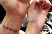 wedding date tattoos done with Roman numbers and placed on the wrists is a cool idea
