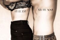 wedding date tattoos placed on the sides and done with Roman numbers is a creative idea