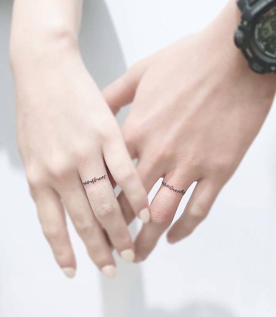 word tattoos instead of traditional wedding bands are a fresh and cool solution for a wedding