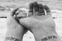 your wedding date in Roman numbers placed on the wrists are veyr cool and stylish matching tattoos
