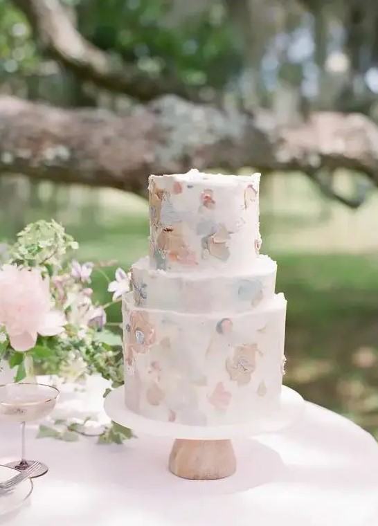 a beautiful pastel brushstroke floral wedding cake is a very tender and romantic piece for a spring or summer wedding