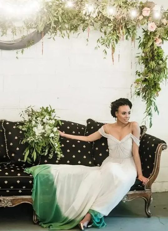 a beautiful spaghetti strap dip dye with green wedding dress with off the shoulder sleeves and silver shoes