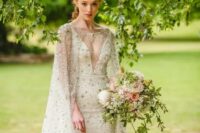 a breathtaking embellished sheath wedding dress with a covered plunging neckline plus a matching capelet