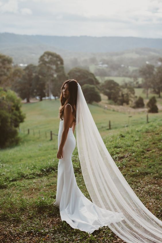 a classic long cathedral veil of one layer is a gorgeous idea to finish off your bridal look