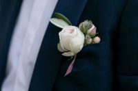 a cool white peony bulb is a chic and cool idea for a modern wedding boutonniere and will add a fresh feel to the look