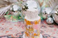 a disco inspired wedding cake with a silver leaf tier, a bold brushstroke one is a lovely and bright idea for a 70s wedding