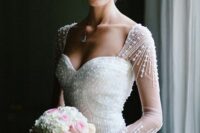 a lovely wedding dress covered with beads
