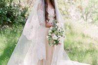 a long cathedral veil with a wide lace edge is a gorgeous addition to a classic and chic bridal look