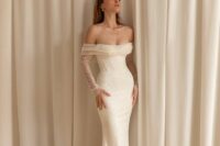 a mermaid off the shoulder fully beaded wedding dress with illusion sleeves and a train is a lovely idea for a glam bride