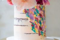 a naked wedding cake with colorful dimensional brushstrokes and super bright blooms on top is a lively and fun idea