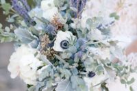 a neutral spring wedding bouquet with lilac, thistles, white blooms and eucalyptus for a romantic spring bride