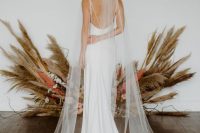a one layer cathedral length wedding veil with scattered pearls and crystals is a beautiful and romantic take on classics
