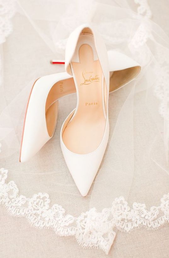 a pair of classic white bridal pumps, partly cut out will never go out of style and will match any bridal look