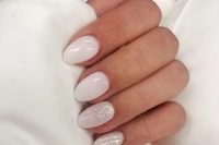 a pretty and glam wedding manicure with white nails and white nails with a bit of glitter is a lovely solution for spring and not only