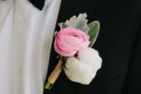 a pretty modern wedding boutonniere with a pink ranunculus, a cotton piece and pale leaves is a beautiful idea for a modern exquisite wedding