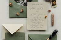 a refined wedding invitation suite in olive green and neutrals, with floral lining, a raw edge and calligraphy is a chic idea