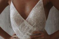 a sexy fully beaded wedding dress with a draped bodice and spaghetti straps is a chic and lovely idea for a glam bride