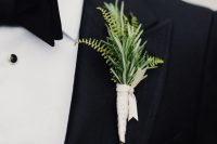 a simple modern greenery wedding boutonniere with a white wrap is a chic idea for a modern groom’s look