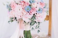 a sweet light pink and blue wedding bouquet plus greenery and blush ribbons for a spring bride