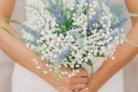 a textural baby’s breath and blue Delphinium wedding bouquet looks ethereal