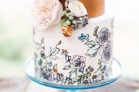 a trendy wedding cake with a copper leaf tier and a pastel handpainted floral tier plus fresh blooms for decor