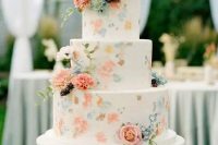 a white buttercream wedding cake with painted pastel blooms and real fresh ones is a perfect solution for spring and summer