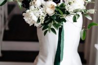 a white wedding mermaid wedding dress, a white bloom and greenery wedding bouquet with emerald ribbons compose a chic combo